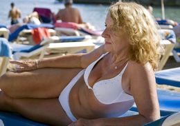 Busty mature women tourists in swimsuits